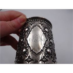 Victorian silver christening mug, with repousse and chased scroll and bead decoration, lozenge shaped cartouche engraved with monogrammed initials and acanthus capped C scroll handle, hallmarked Robert Hennell III, London 1861, H9.3cm