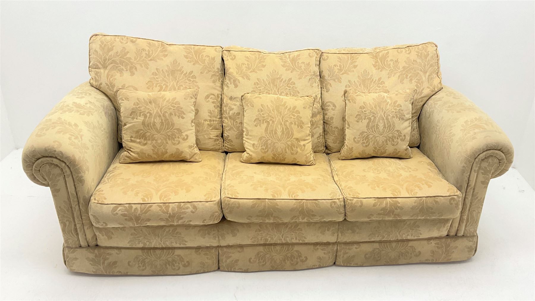 Duresta Waldorf Grande - three seat sofa (L230cm, D100cm) and matching armchair (W115cm, D100cm), scroll arms, upholstered in a pale gold foliate patterned fabric with matching scatter cushions 