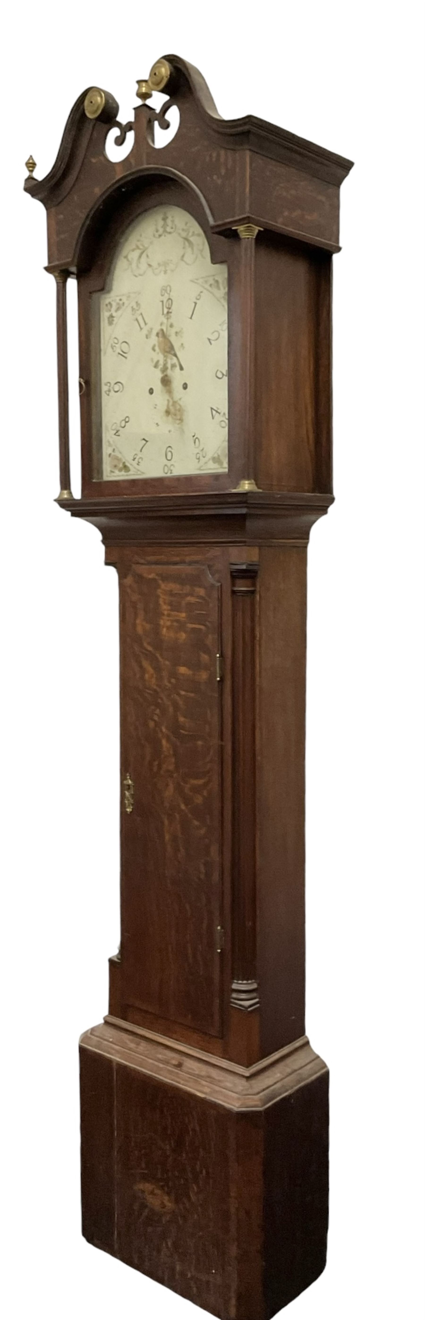 Late 18th century oak 8-day longcase clock, with a swan necked pediment and brass paterie, 
break arch hood door flanked by detached reeded pilasters, trunk with recessed quarter pillars and a long flat topped door, on a square plinth with canted corners, early painted dial with Arabic numerals and floral decoration to the arch and spandrels, with stamped brass hands and date recorder, weight driven two train movement with baluster movement pillars and an internal countwheel strike (bell missing). With pendulum and weights.  No makers name.