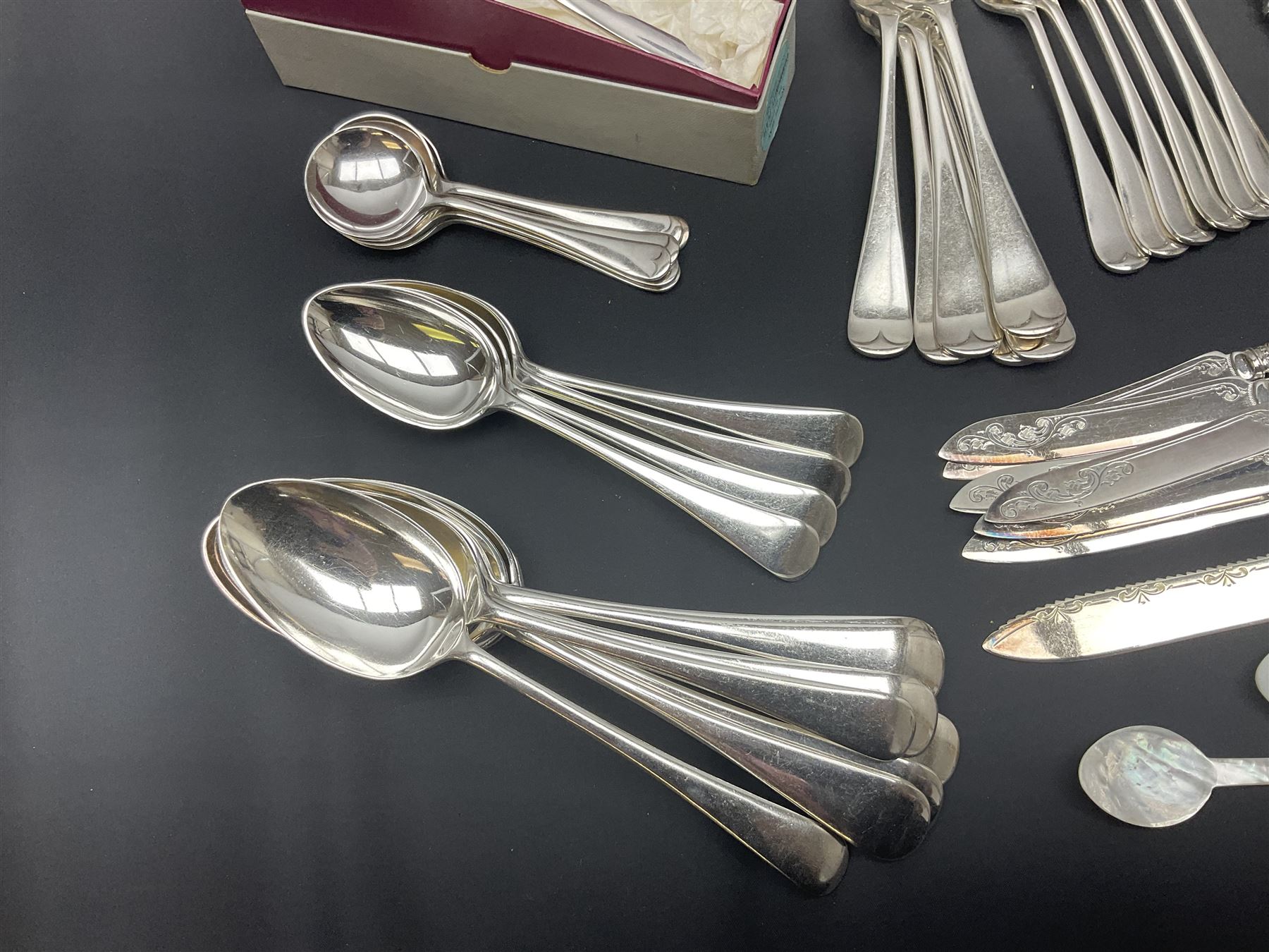 Mother of Pearl handled cutlery, with silver ferrules, comprising six fish knives and forks and six fruit knives and forks, the ferrules hallmarked Yates Brothers, Sheffield 1905, together with silver plated Edwardian three piece tea service and other flatware 