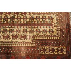 Two hand-knotted rugs, comprising Persian runner and Turkoman prayer rug, Persian hand-knotted runner, red and dark navy ground with four diamond medallions and geometric motifs, enclosed by multicoloured geometric border, striped kilim ends with fringes, H244cm, W58cm; Turkoman hand-knotted prayer rug, ivory mihrab field decorated with repeating stylised geometric motifs, enclosed by multiple geometric borders in madder red and brown, with fringed ends, H150cm, W93cm