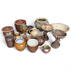 Large assorted collection of glazed stoneware jars and planters, with two lidded crocks, a...