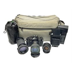 Canon A1 35mm camera body serial no 741264, with 'Tokina AT-X 28-85mm 1:3.5-4.5' lens serial no 821679, 'Canon FD 50mm 1:1.8mm' lens and other camera equipment 