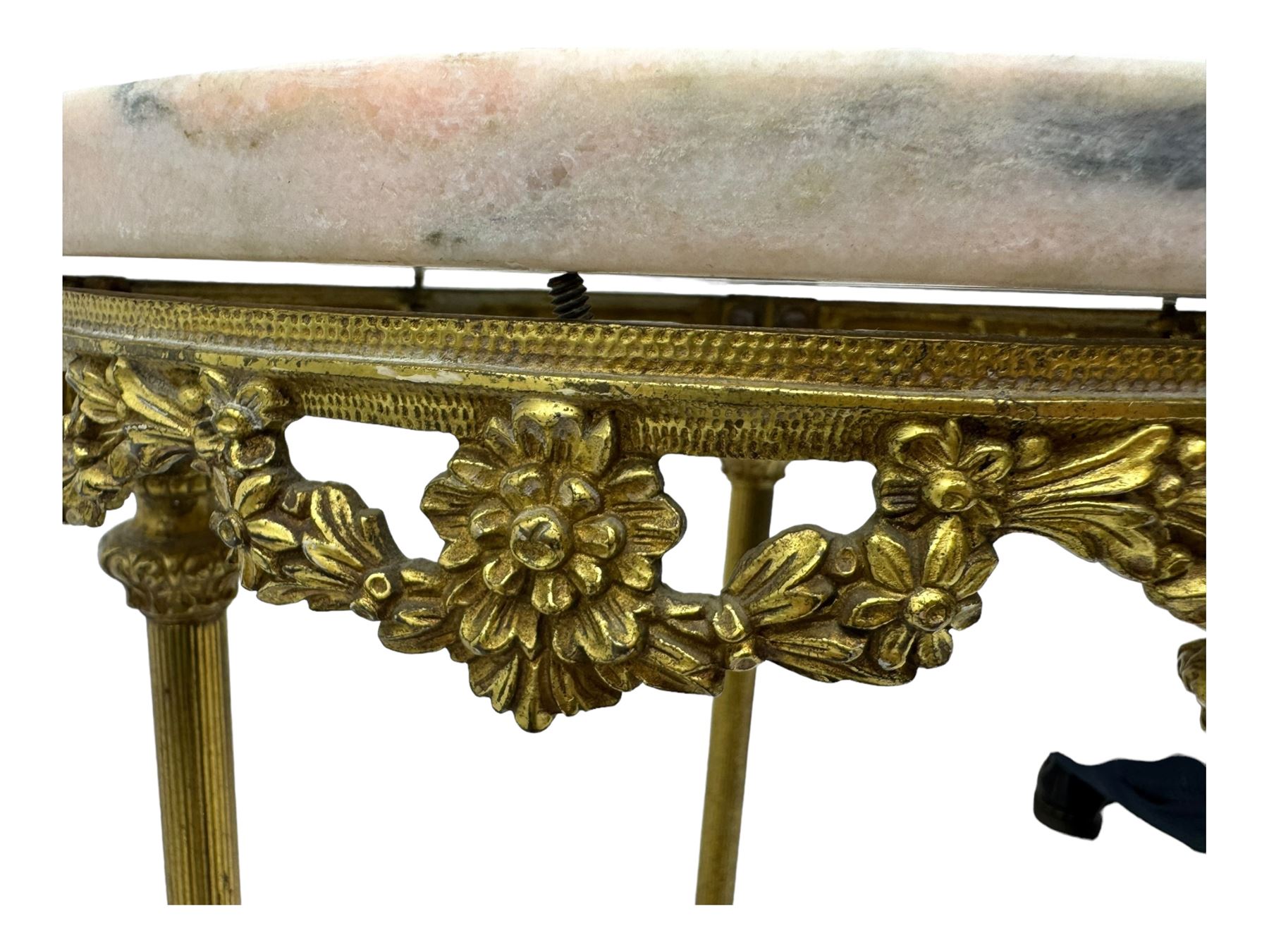 Late 20th century cast gilt metal and marble two-tier stand, pink and grey marble top and undertier, the base decorated with floral garlands, on reed moulded supports with splayed terminals 