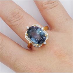18ct gold oval cut fancy colour tanzanite and round brilliant cut diamond cluster ring, hallmarked, tanzanite approx 9.00 carat
