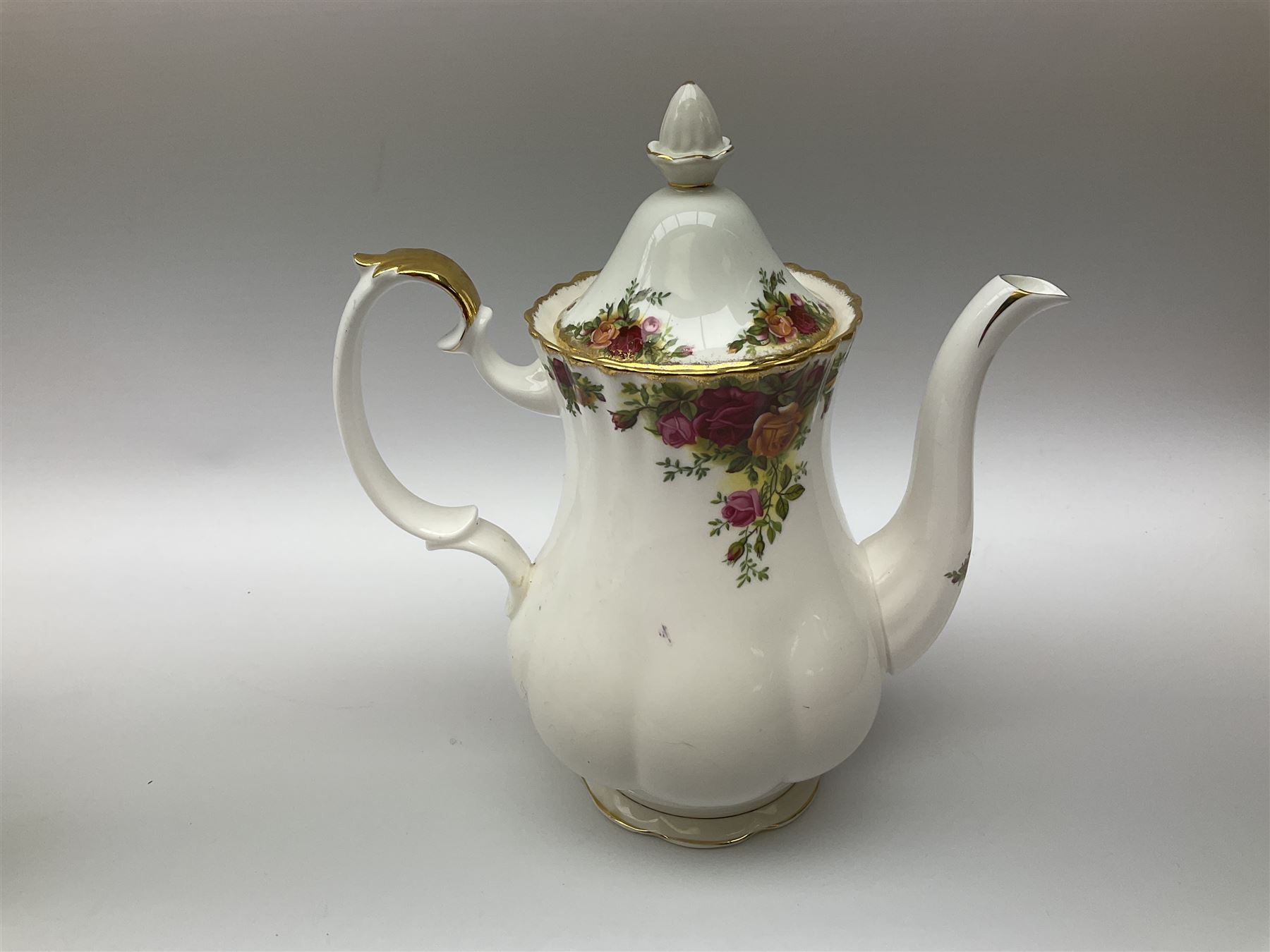 Royal Albert Old Country Roses pattern tea set, comprising teapot, coffee pot, six teacups and six saucers, five side plates, further teacup with joined saucer and side plate, open sucrier, milk jug, cake plate, and preserve pot and cover, together with Royal Albert Jubilee Rose pattern sauce boat and stand, and Royal Albert Lavender Rose pattern cake stand. 