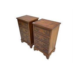 Pair of Georgian design yew wood bedside chests, crossbanded rectangular top with ebonised stringing, fitted with four cock-beaded drawers