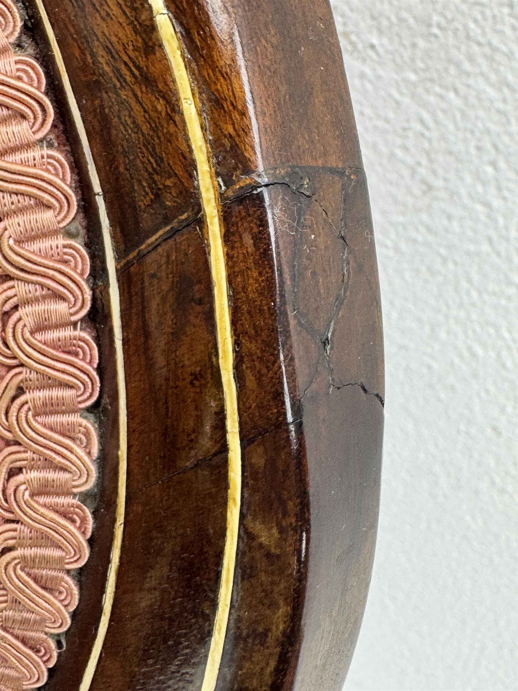Pair of Edwardian inlaid rosewood salon chairs, upholstered in dusky pink fabric with gimp trim, oval backrest with carved crest rail with central shell motif and pierced splat, on cabriole supports terminating in castors