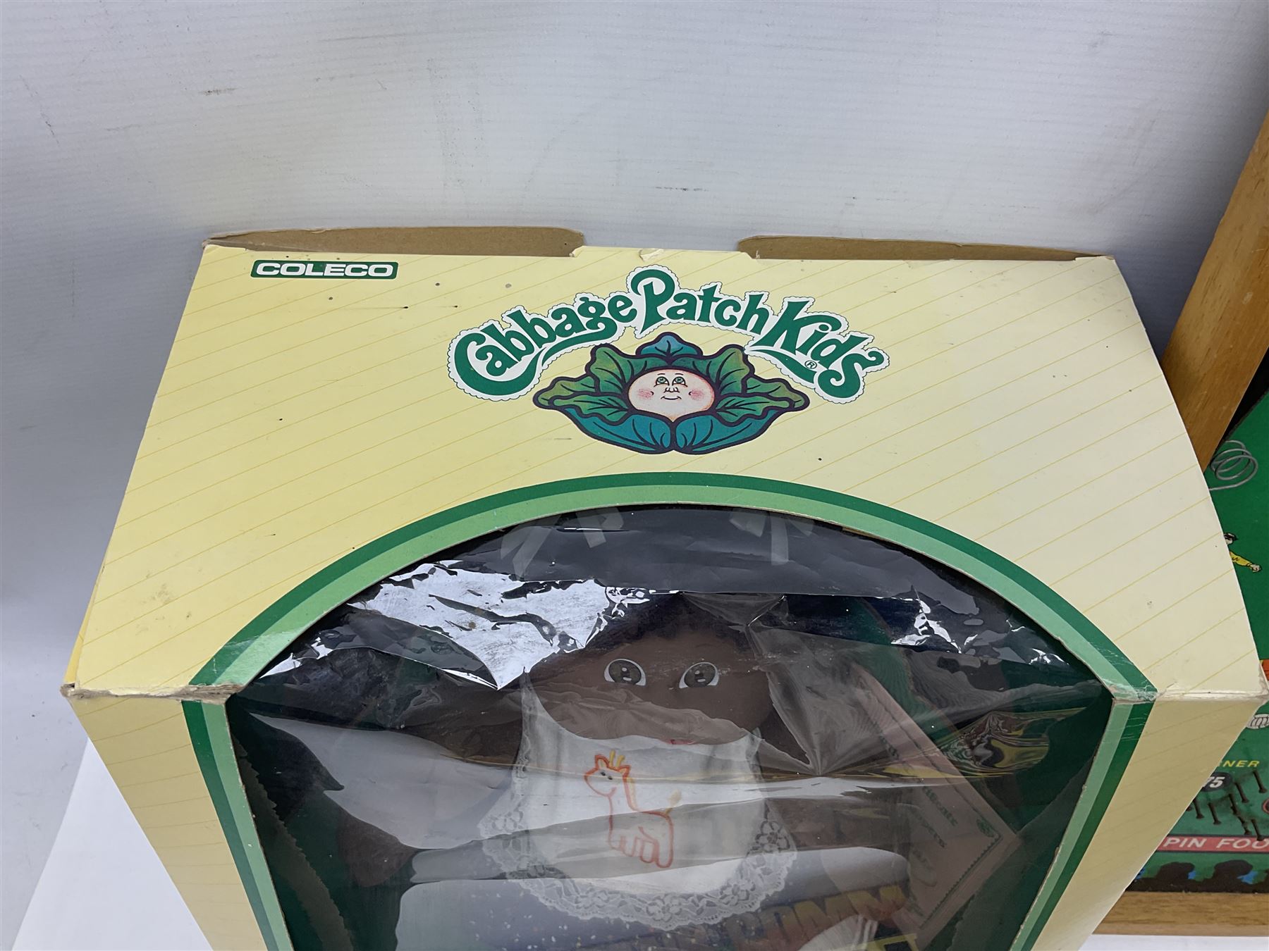 Ideal 'Tank Command' battle action game; boxed; Kay 'Pin Football' bagatelle game; Coleco Cabbage Patch Kids 'Carita Aleen' doll; boxed with certificate; and Palitoy composition head and body doll; boxed (4)