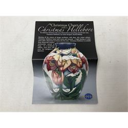Moorcroft vase decorated in Christmas Hellebore pattern, designed by Rachel Bishop, with impressed and painted marks beneath, in original box,  H14cm