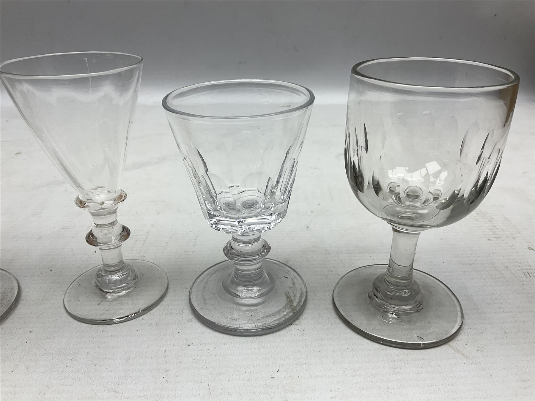 Quantity of Georgian and Victorian glasses, comprising late 19th century Beehive decanter, two thumb print rummer glasses, two 1780s Bristol glass of wrythen form, early Victorian toastmasters glass, two late Georgian wine glasses, late 18th century petal moulded wine glass, and early 19th century facet cut small wine glass
