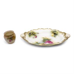 Early 20th century Royal Worcester twin handled dish, painted with roses and buds, within a green and gilt moulded border, signed by J. Lander, L31cm, together with a Royal Worcester vase hand painted with roses, no. 2491, unsigned (2)