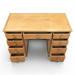 20th century ash twin pedestal desk, gadroon galleried top, twin bank of graduated drawers, plinth base