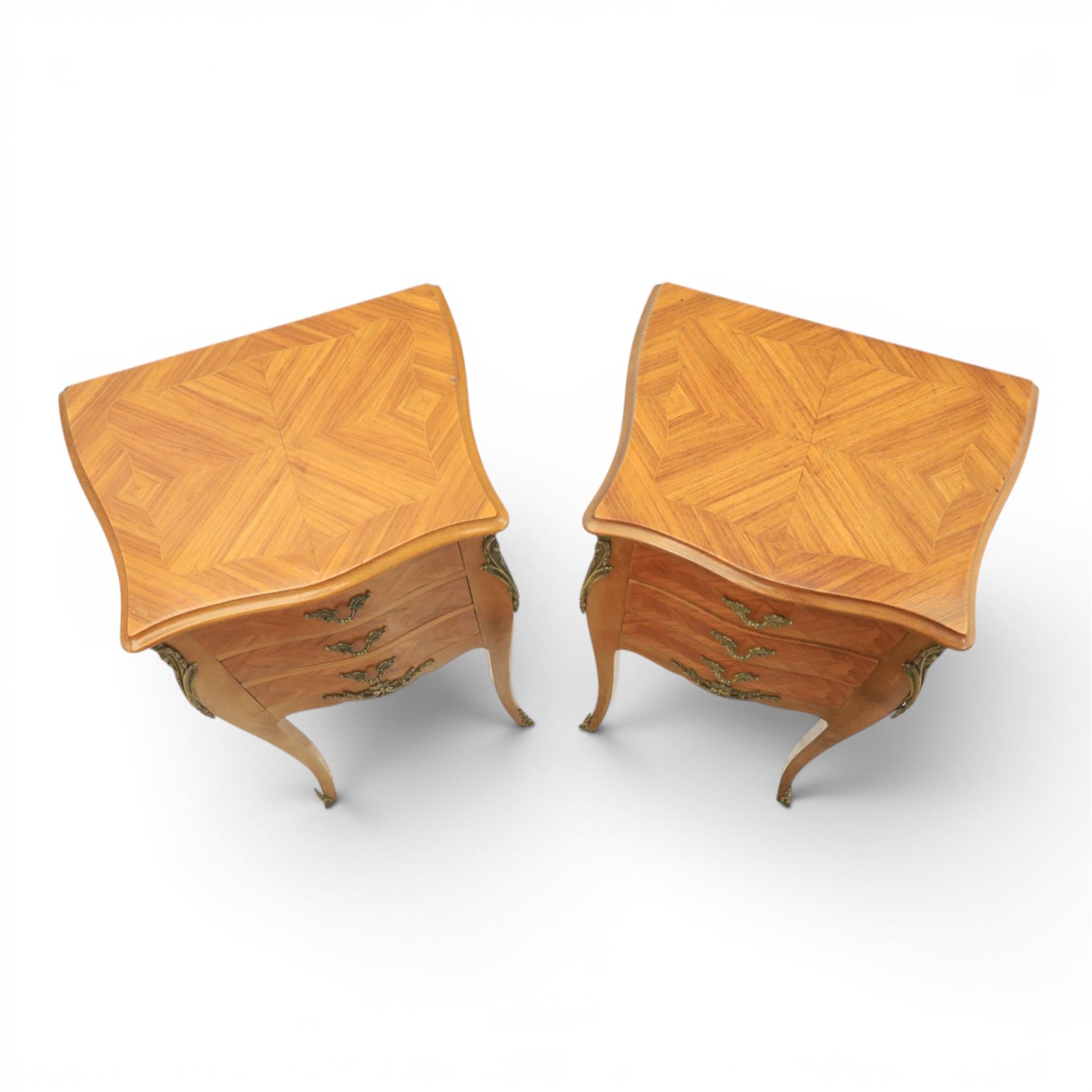 Louis XV style pair of kingwood bedside chests, each of serpentine outline with three parquetry drawers, gilt metal mounts and handles, raised on slender cabriole legs