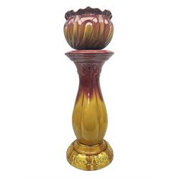 Bretby Jardiniere and stand, with foliate and foliage decoration with a red and yellow ground, impressed mark beneath H94cm