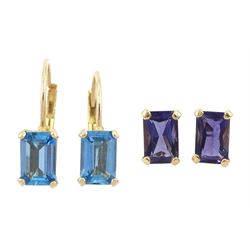 Pair of gold tanzanite stud earrings and a pair of gold blue topaz pendant earrings, both stamped 10K
