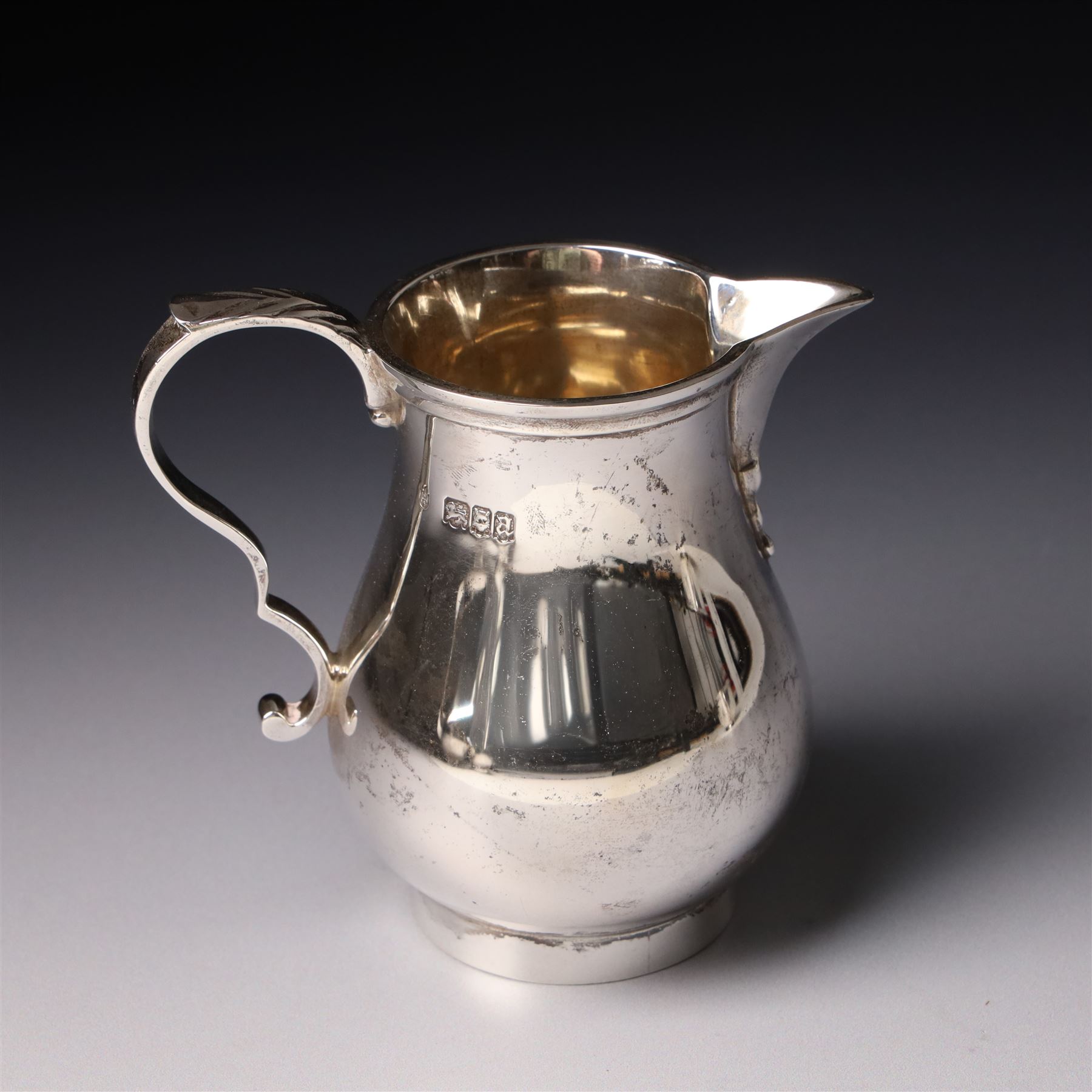 Four piece silver tea and coffee service of baluster form, the tea and coffee pots with domed covers and stained handles London 1916-1918, Maker  C S Harris & Sons Ltd