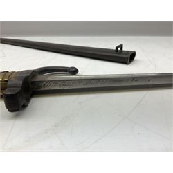 French model 1866 sabre bayonet, the 57.5cm curving blade marked St. Etienne 1868; in associated steel scabbard L71cm overall