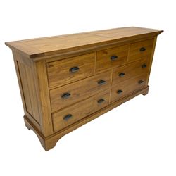 Light oak finish seven drawer chest