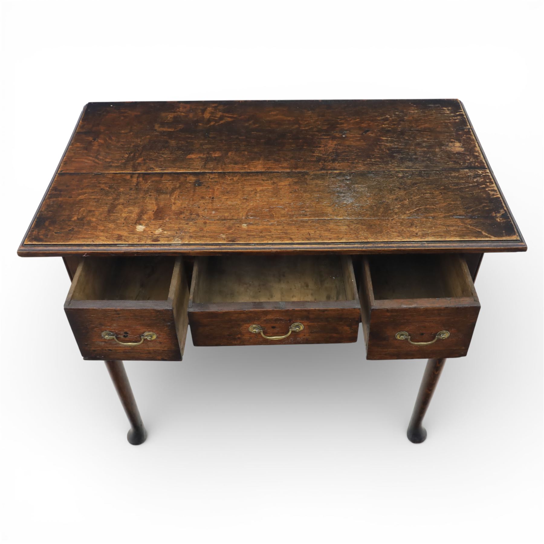 Georgian oak lowboy, the rectangular top with moulded edge over three fitted drawers and shaped apron, raised upon slender cabriole legs, with pad feet