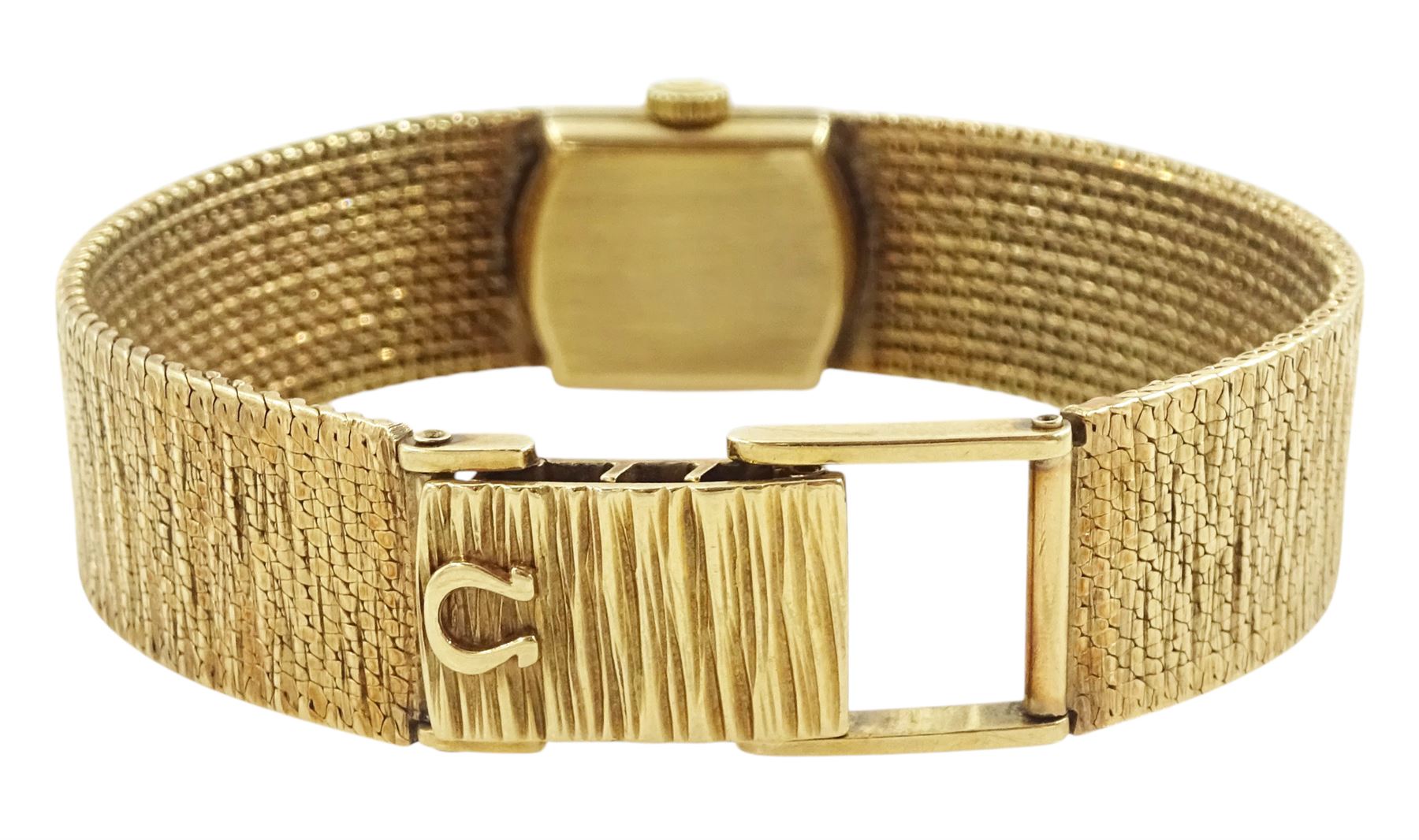 Omega ladies 9ct gold manual wind wristwatch, champagne dial with baton hour markers, on integral 9ct gold bracelet, London 1956