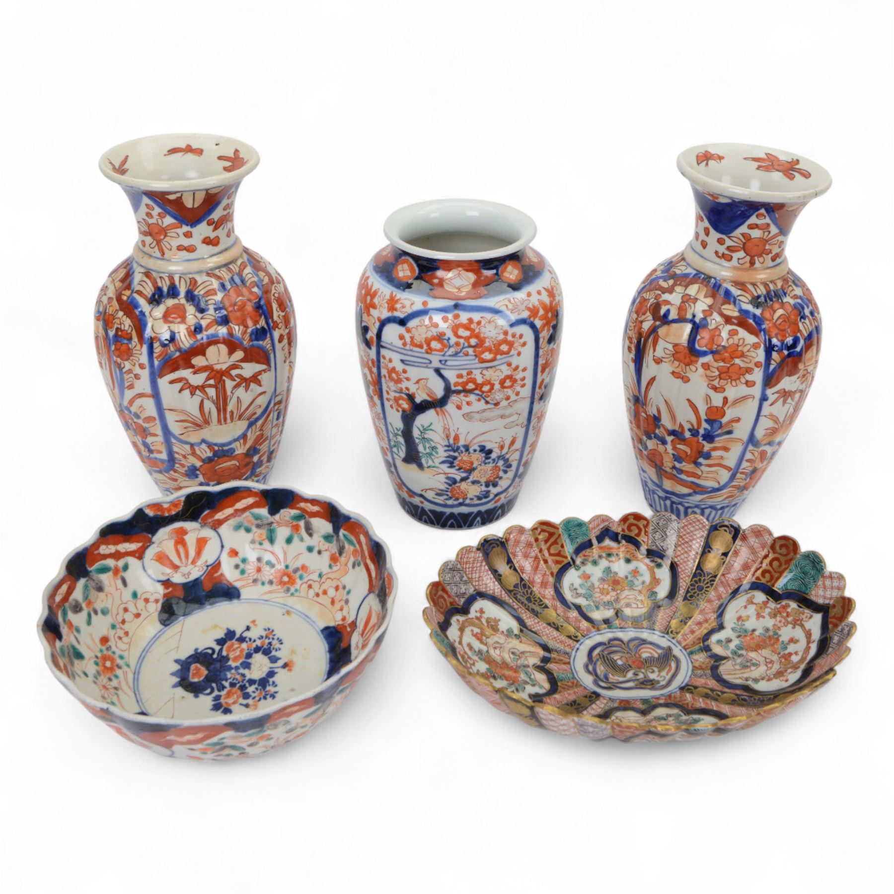Japanese Imari dish, with scalloped edge, the internal decoration with panels of blossoming branches and a central bird, together with another imari bowl and three vases, scalloped dish H7cm