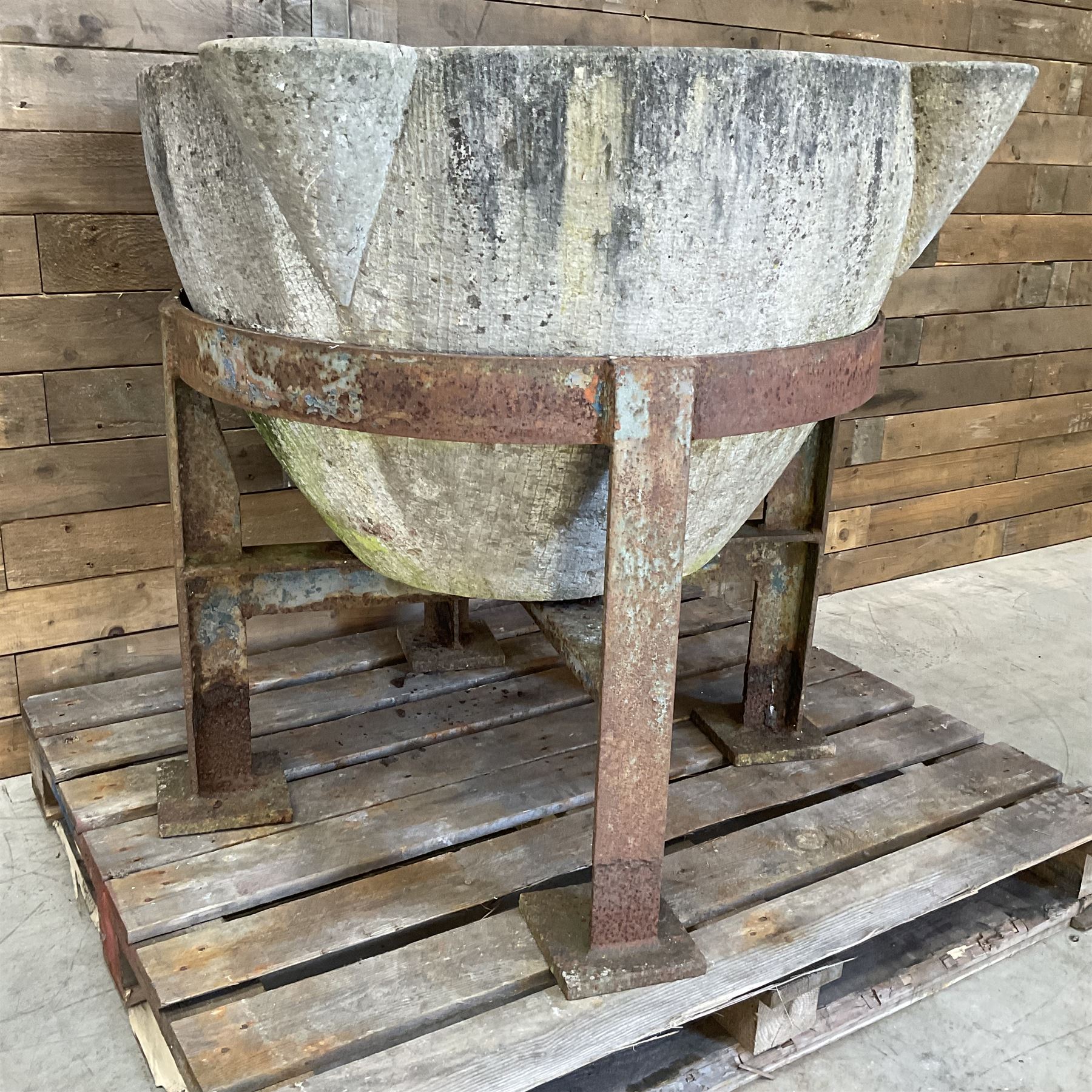 Large 19th century circular stone mortar planter on wrought iron stand