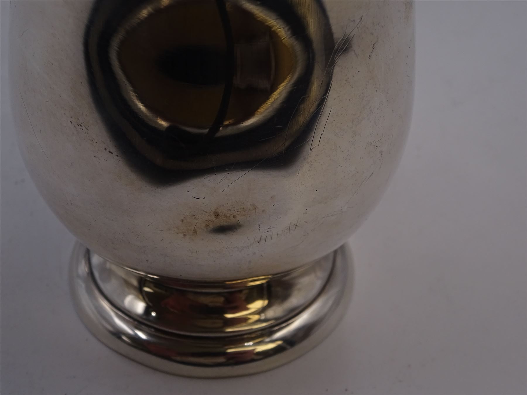 1930s silver Christening mug, of plain waisted form, with acanthus capped scroll handle, upon stepped circular foot, hallmarked Barker Brothers Silver Ltd, Birmingham 1933, including handle H10cm 