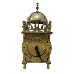 Two 29th century reproduction German traveling clockmaker figures and a small battery operated miniature lantern clock