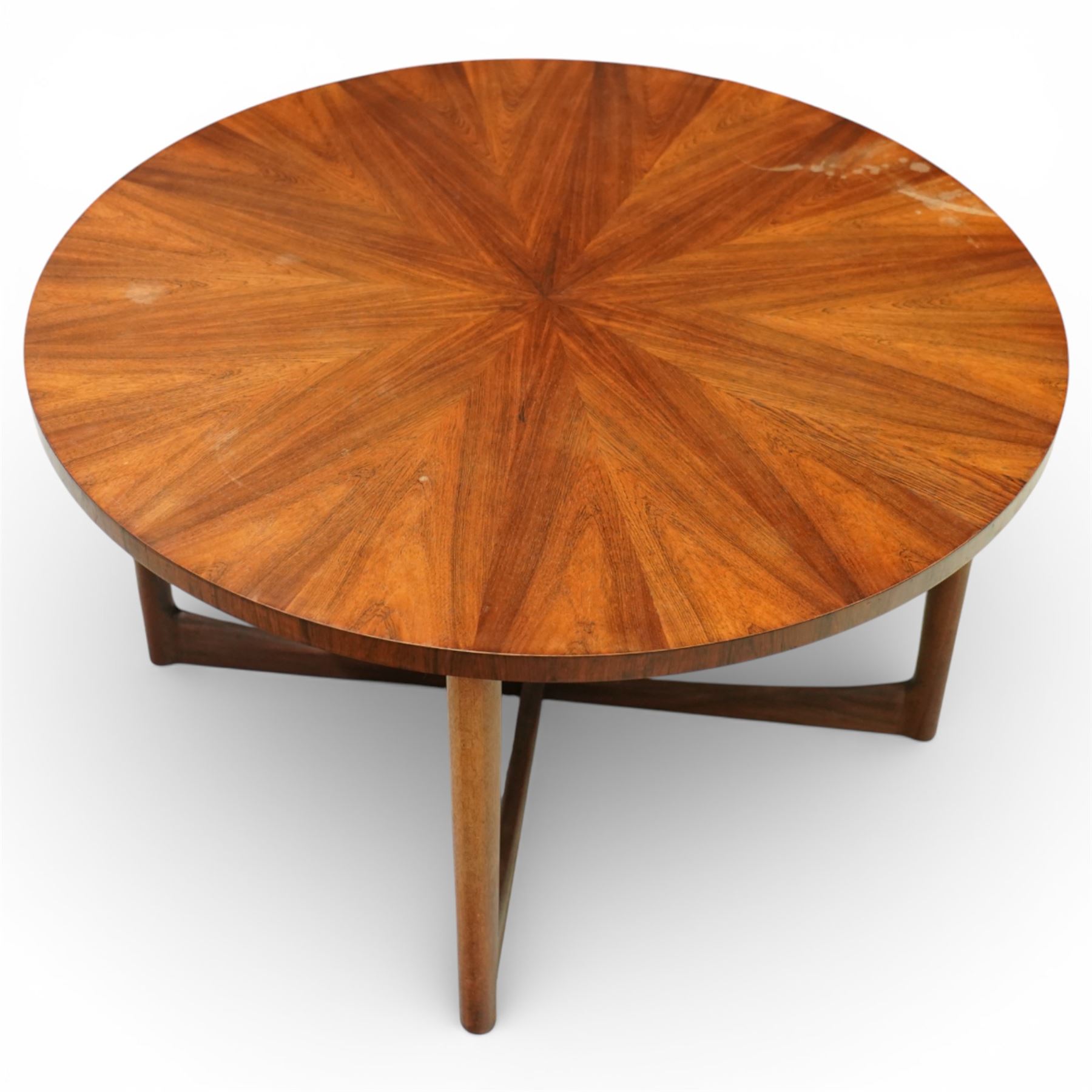 McIntosh of Kirkcaldy - Mid 20th century circular teak coffee table, circular top with book-matched radial veneers forming a starburst pattern and plain edge, raised on four tapered supports united by a shaped stretcher frame