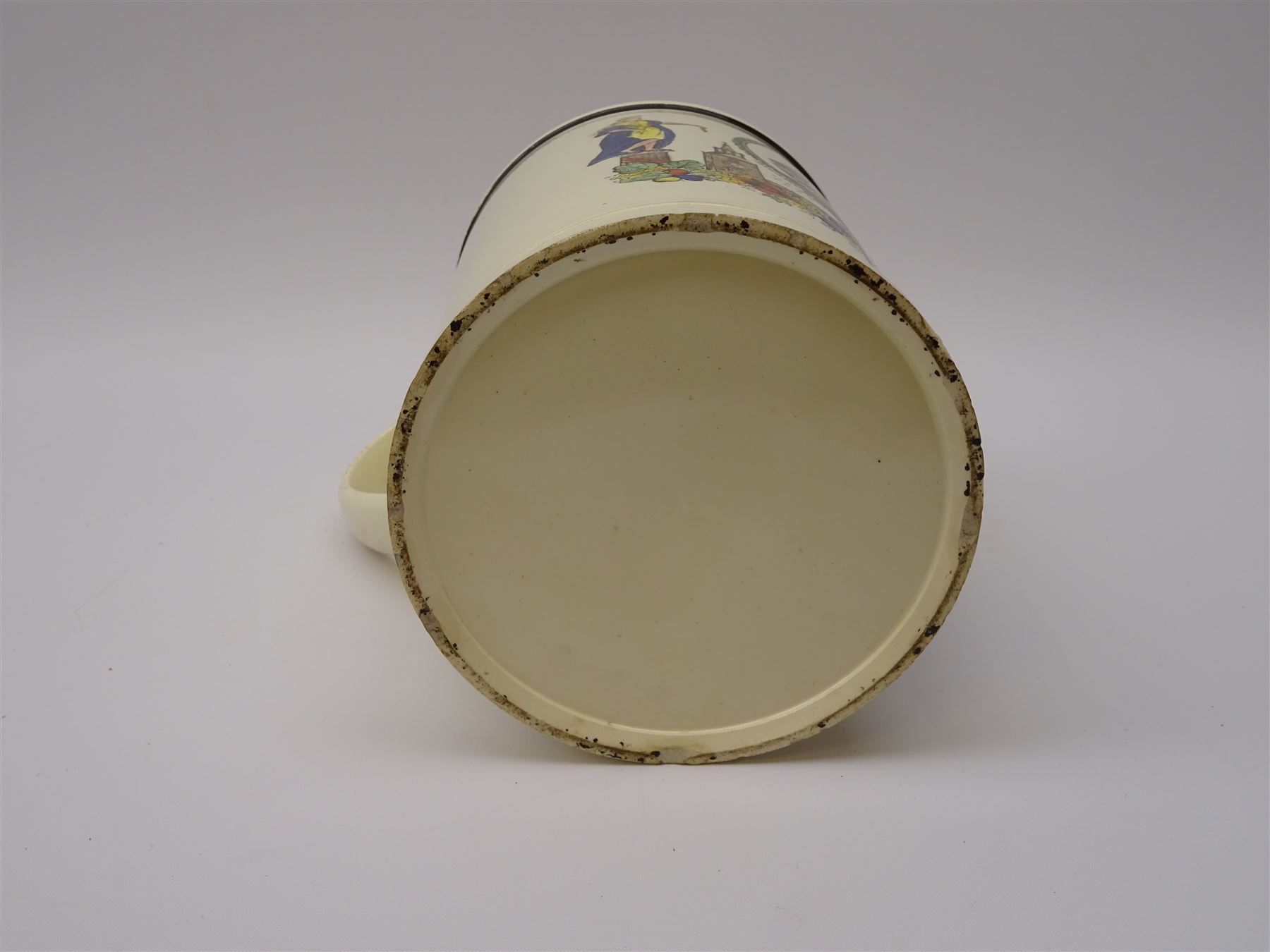 Early 19th century Sunderland Dawson & Co creamware pottery mug, the cylindrical body black transfer printed and polychrome detailed with a circular panel of a three-masted ship flanked by two figures of Peace and Plenty, above a panel containing verse 'May Peace with Plenty on our Nation smile [...]' H15cm D11cm