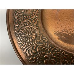 Arts and Crafts Keswick School of Industrial Arts copper charger, decorated with planished centre and repousse scrolling foliate tendrils to rim, D44cm