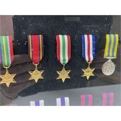 Limited edition large framed display board with sixty half-size copies of British Gallantry and Campaign Medals produced by Danbury Mint; all with ribbons and associated booklet