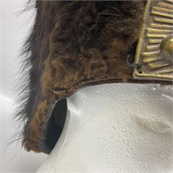 French Grenadier's bearskin hat, the embossed brass plate with crowned eagle, flaming grenades and arrow flashes; leather headband and traces of manuscript label internally