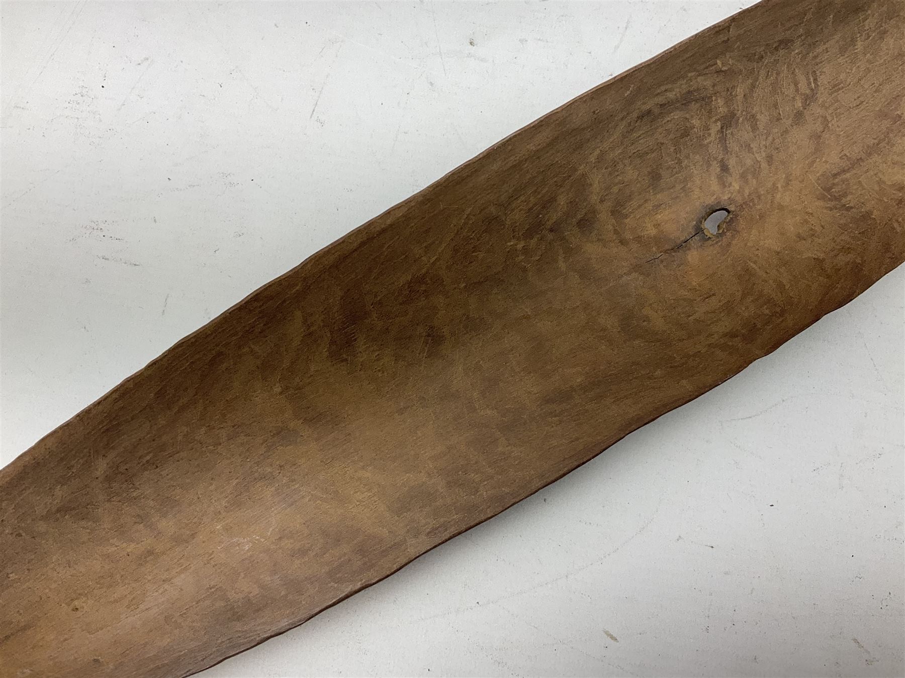 Australian Aboriginal shield, carved with Kangaroo and Emu, 74.5cm; Spear painted with aquatic creatures 78cm, and Spear thrower 81cm (3)