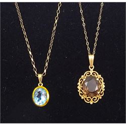 9ct gold oval blue topaz pendant necklace and a 9ct gold smoky quartz pendant necklace, both hallmarked 
