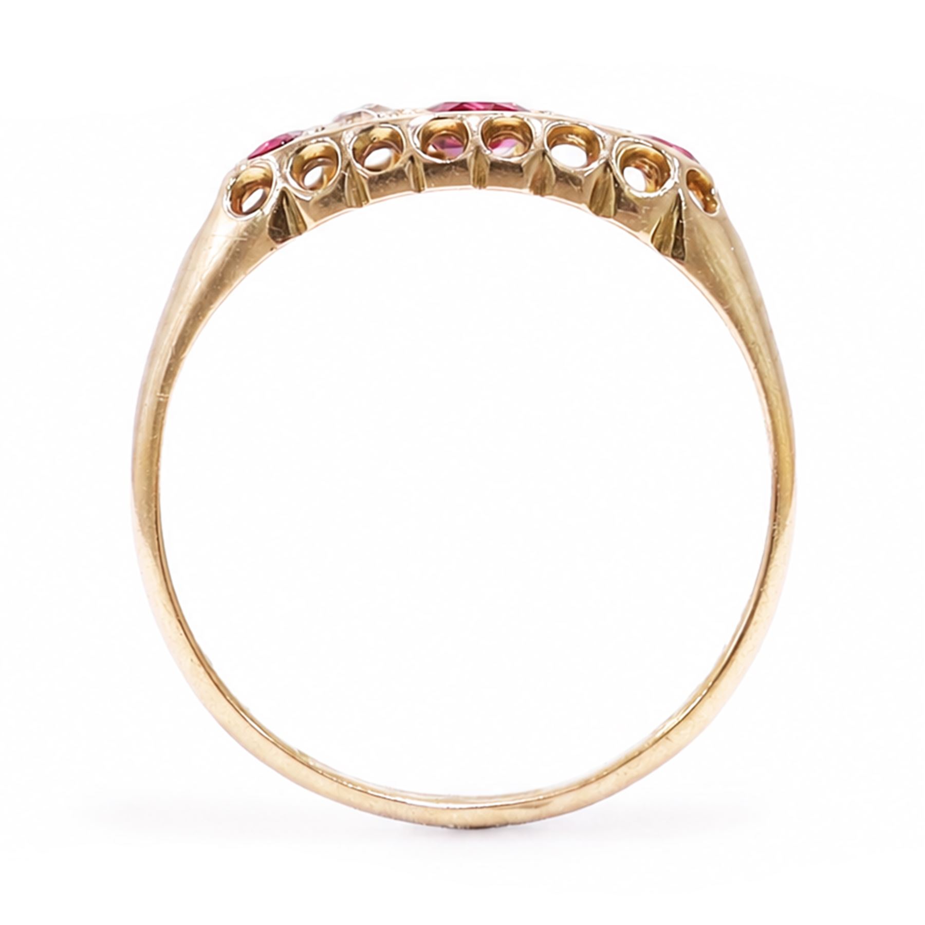 Early 20th century 18ct gold ruby and diamond ring, three round cut rubies, spaced by two old cut diamonds, Chester 1914, 