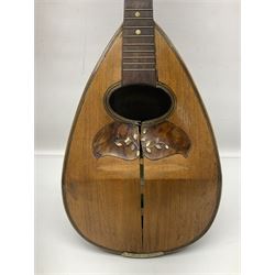 Late 19th century Italian lute back mandolin with segmented bowl back, bears label Gennaro Maglioni Napoli L61cm; in ebonised wooden case; together with another similar damaged Italian lute back mandolin for restoration or spares (2)