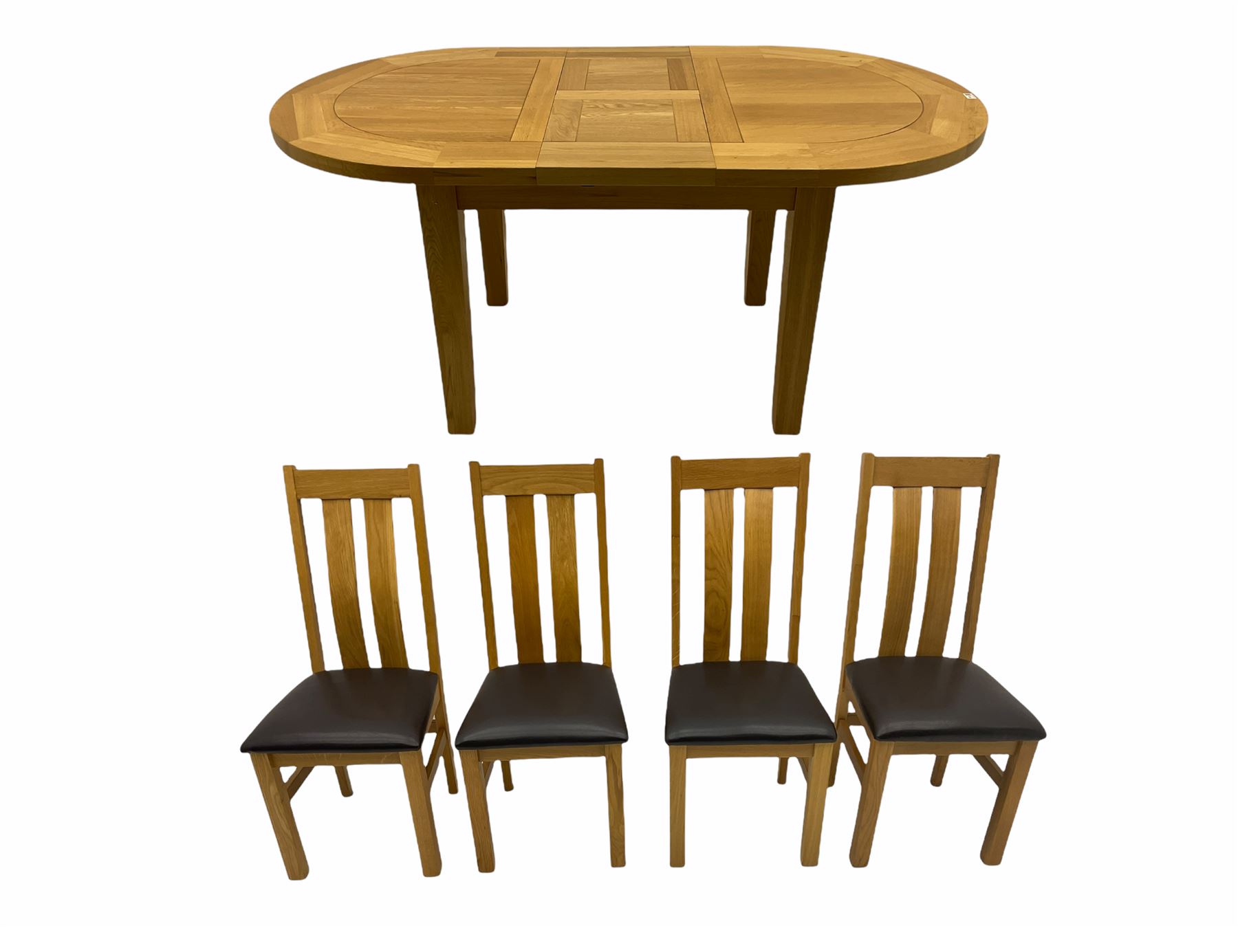 Solid oak oval extending dining table, butterfly leaf extension, four chairs with brown upholstered seats