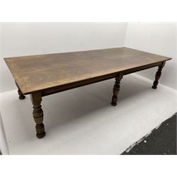 Large early 20th century oak boardroom table, rectangular moulded top on six turned and faceted supports 