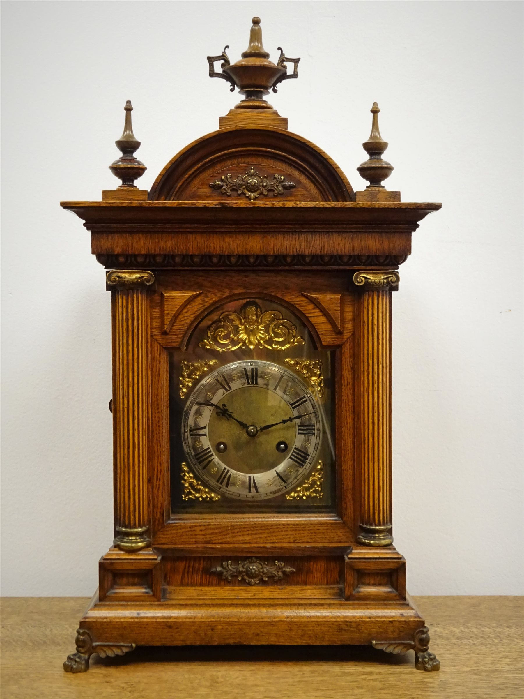 Edwardian oak architectural mantle clock circa 1908, arched top with