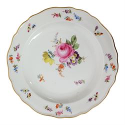 Four early 20th Century Meissen plates, hand painted with floral sprays, sprigs and inspects, with underglaze blue cross sword mark beneath, D21.5cm