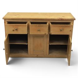 Victorian pine dresser base, with rectangular plank top, above three short drawers over two cupboard doors