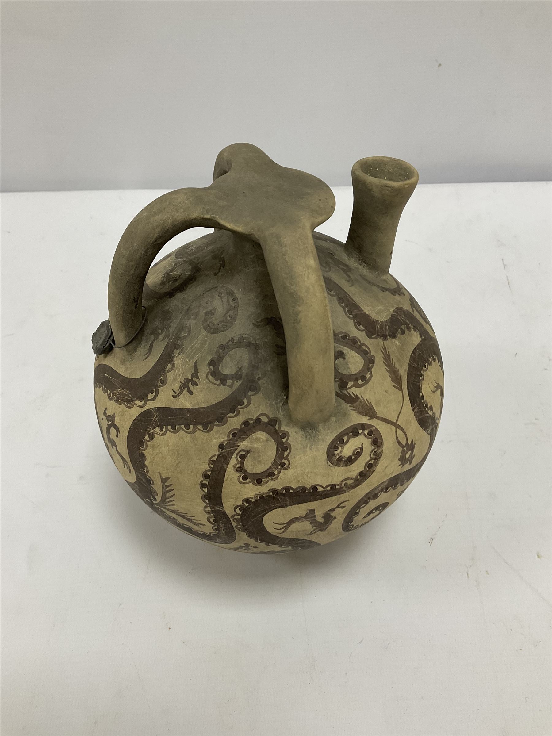 Reproduction Ancient Greek vessel in the style of Crete Minoan period, decorated with marine style ocotopi, with three handles and spout, signed beneath, H20cm