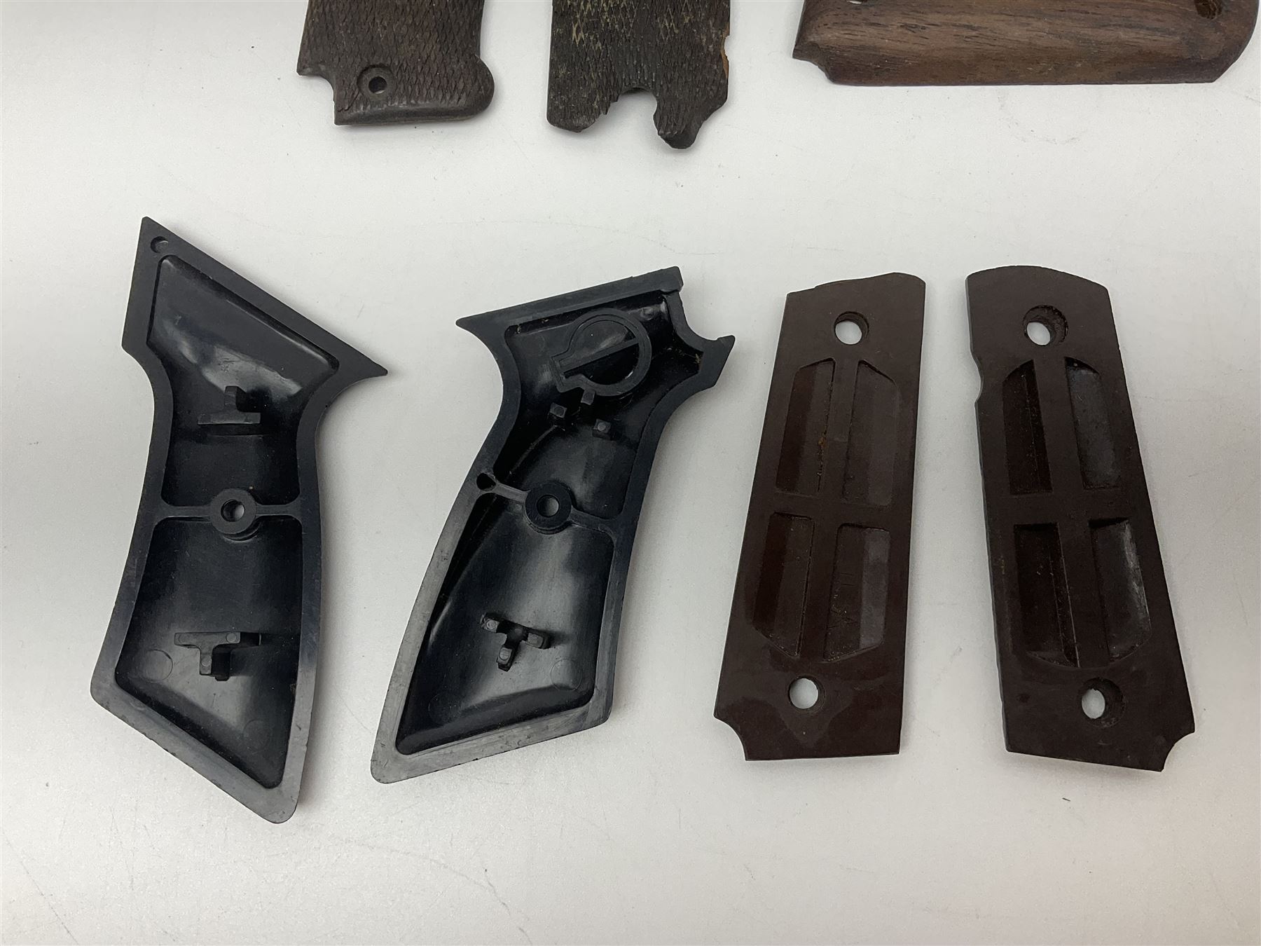 Six pairs of revolver grips;  pair of Lightwood & Son Ltd powder/shot measures in original box; and boxed Colt hammer shroud 