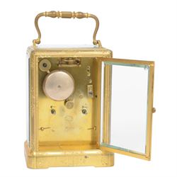 Late 19th century French 8-day brass cased carriage clock, Henry Marc of Paris, the gorge case with swing handle and four bevelled glass panels, white enamelled dial with Roman numerals and minute markers and steel hands, the two train movement with platform lever escapement, hour striking on a bell, with key