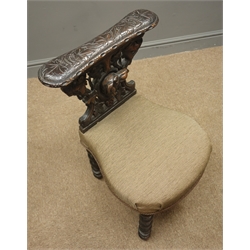  Late 19th century oak reading chair, carved with hound mask and foliage, barley twist supports, upholstered seat   