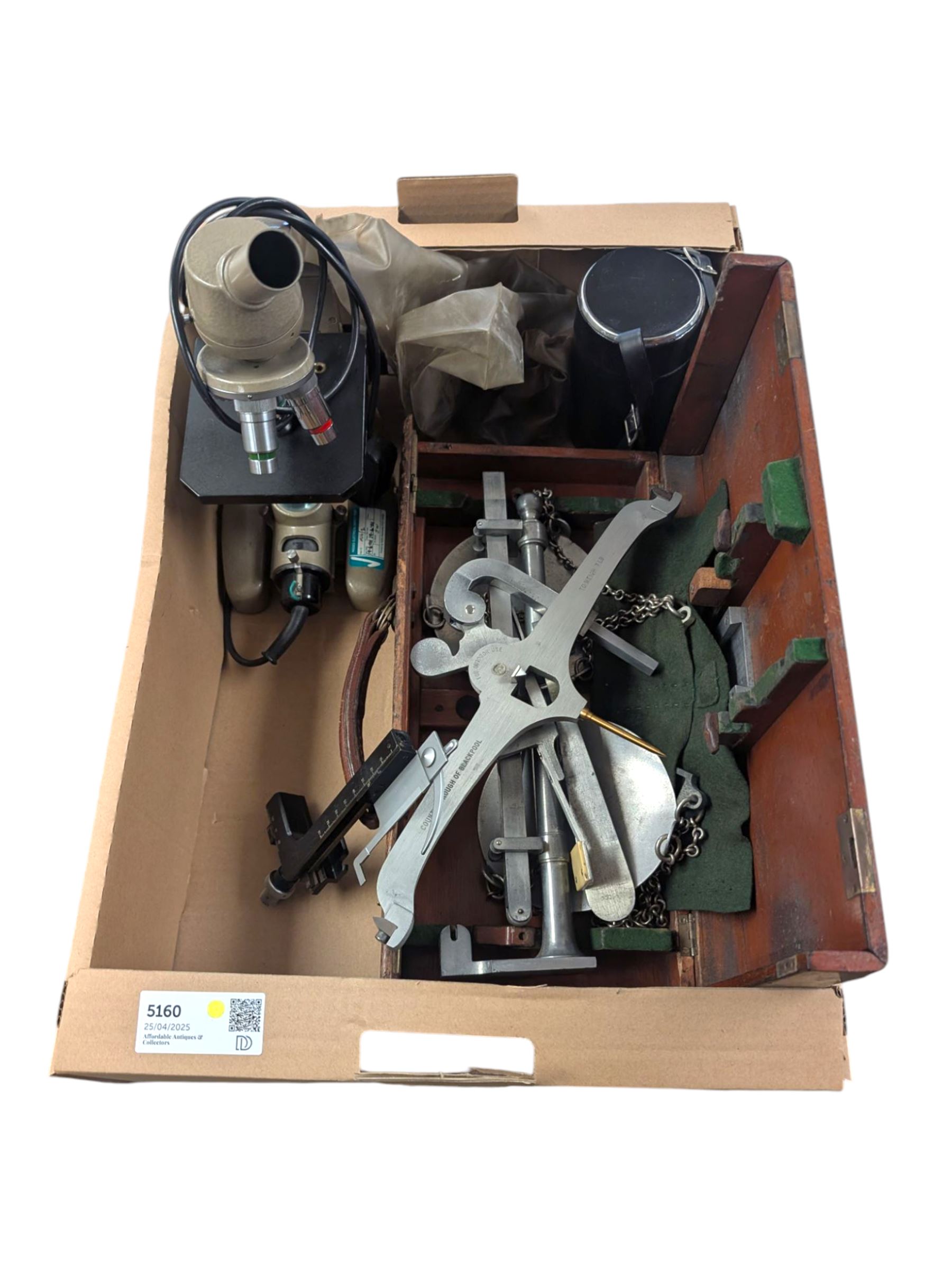 Sigma Multi Telemax 1:2.8 f=135mm lens, a set of DE Grave 7lb scales with County Borough of Blackpool scales in mahogany box and a Vickers Instruments microscope