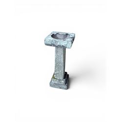 19th century weathered sandstone birdbath, formed in four sections, square top with carved shell bath, raised on tapering column with stepped base