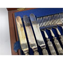 Victorian silver plated dessert set by Elkington & Co for twelve place settings, each reeded handle with vacant cartouche, each with Elkington & Co mark, date letter for 1861, and registration lozenge, contained within a mahogany case with vacant brass cartouche to the hinged cover, opening to reveal a Royal blue baize lined interior with removable tray, case H6cm W29.5cm D26.5cm